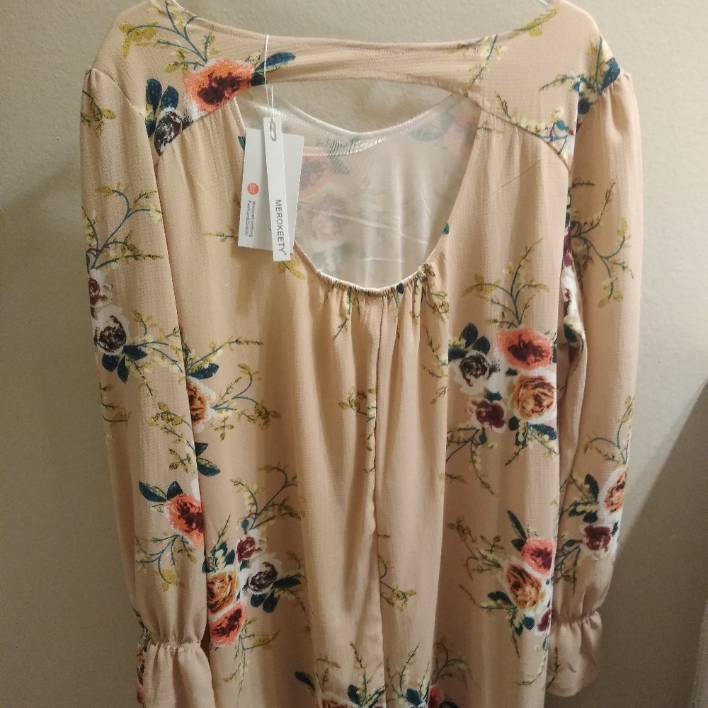 Tan dress with flower design.